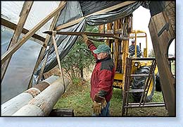 John Wooten directs placement of the mNow that is a big tarp