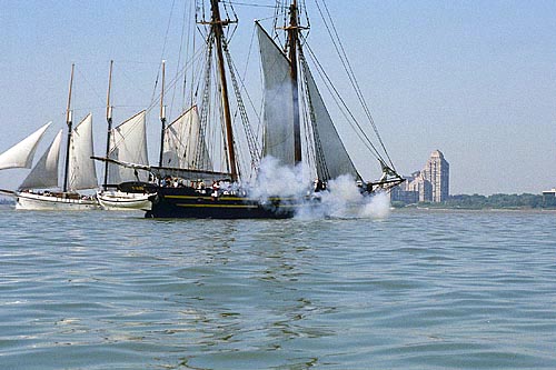 Tall ship firing cannon